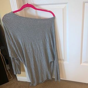 Three-quarter sleeve gray, off the shoulder top from these three boutique
